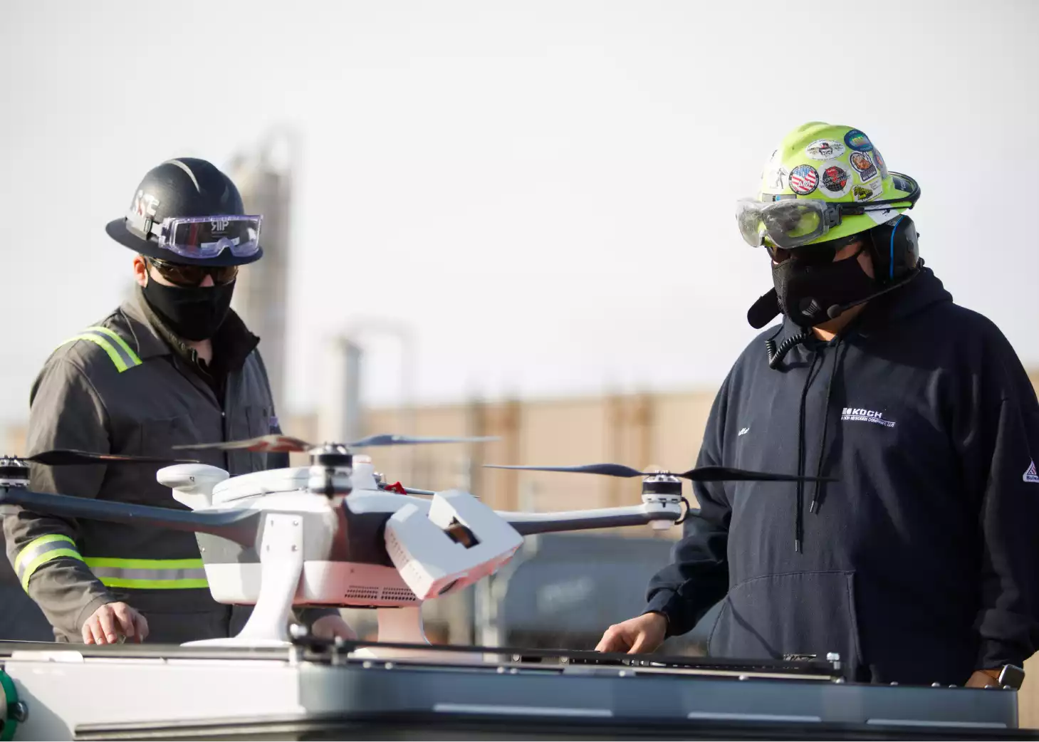 Two men in safety gear work with Autonomous Drones at Koch Fertilizer